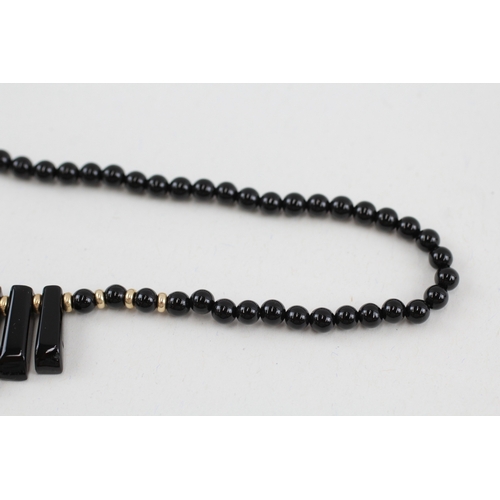 102 - 2x 9ct gold black onyx necklaces (40.4g)