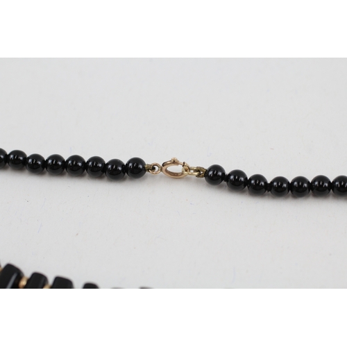 102 - 2x 9ct gold black onyx necklaces (40.4g)