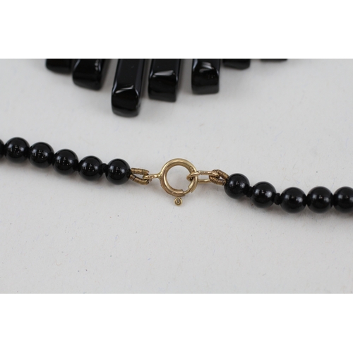 102 - 2x 9ct gold black onyx necklaces (40.4g)