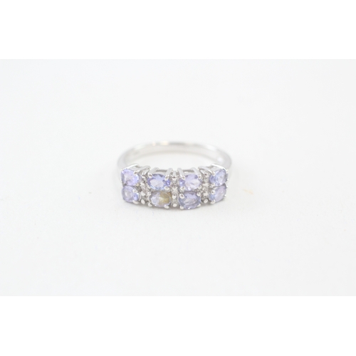 115 - 9ct gold oval cut tanzanite & diamond dress ring, claw set (3.1g) Size  P 1/2