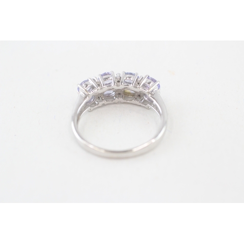 115 - 9ct gold oval cut tanzanite & diamond dress ring, claw set (3.1g) Size  P 1/2