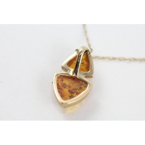 135 - 9ct gold amber pendant necklace (2.6g)