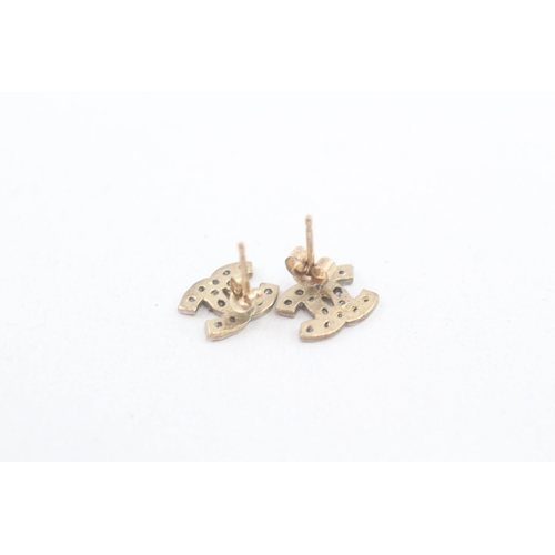 137 - 9ct gold Chanel style cubic zirconia CC stud earrings (0.9g)