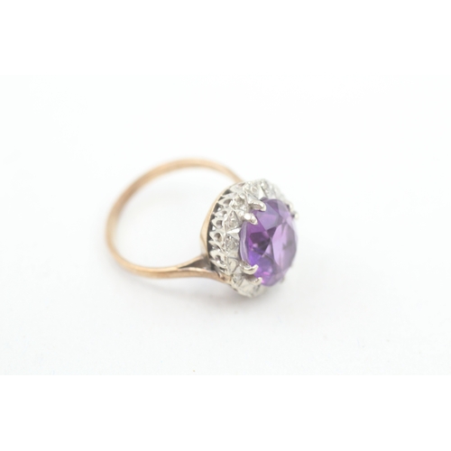 141 - 9ct gold diamond & amethyst oval halo ring (4.2g) Size  O