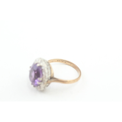 141 - 9ct gold diamond & amethyst oval halo ring (4.2g) Size  O