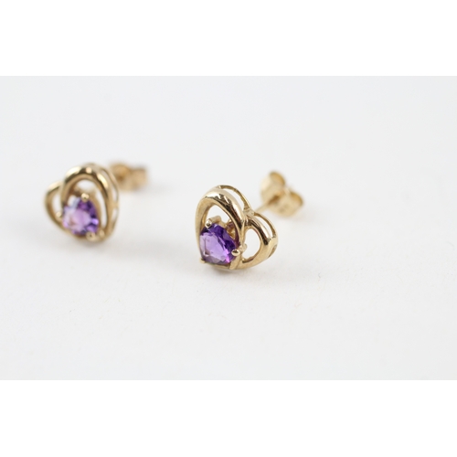 144 - 9ct gold amethyst heart shape stud earrings with scroll backs (1g)