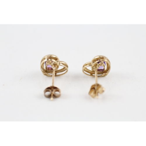 144 - 9ct gold amethyst heart shape stud earrings with scroll backs (1g)