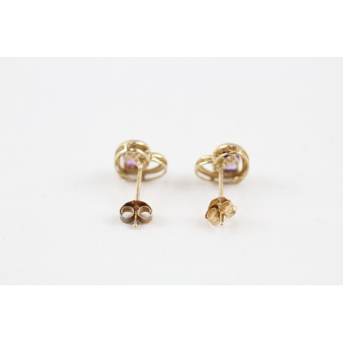 144 - 9ct gold amethyst heart shape stud earrings with scroll backs (1g)