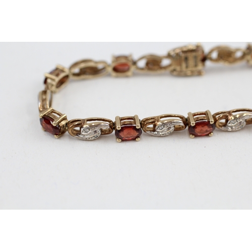 179 - 9ct gold garnet and diamond tennis bracelet (9.9g)