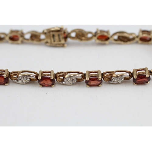 179 - 9ct gold garnet and diamond tennis bracelet (9.9g)