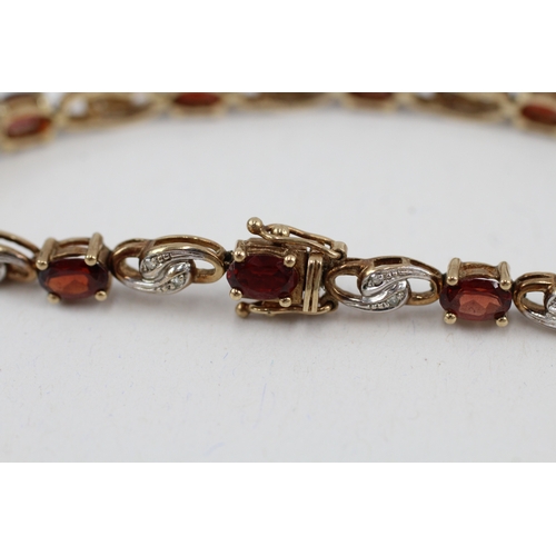 179 - 9ct gold garnet and diamond tennis bracelet (9.9g)