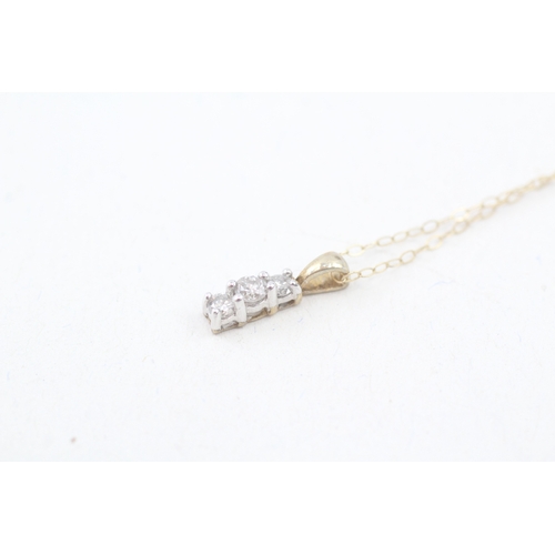 191 - 9ct gold diamond trilogy pendant with 9ct gold chain (0.8g)