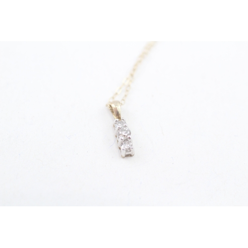 191 - 9ct gold diamond trilogy pendant with 9ct gold chain (0.8g)