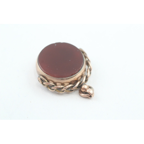 192 - 9ct gold antique carnelian and bloodstone spinner fob (7.8g)