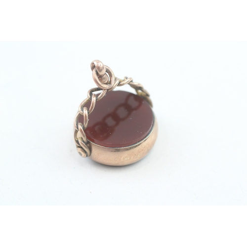 192 - 9ct gold antique carnelian and bloodstone spinner fob (7.8g)