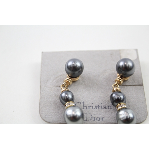 216 - Pair of gold tone simulated pearl drop earrings by designer Christian Dior