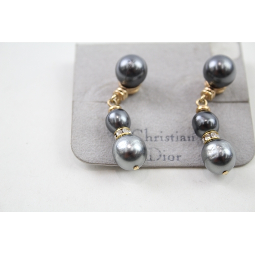 216 - Pair of gold tone simulated pearl drop earrings by designer Christian Dior