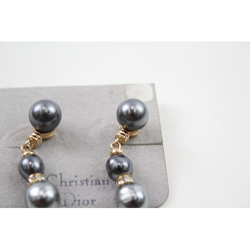 216 - Pair of gold tone simulated pearl drop earrings by designer Christian Dior