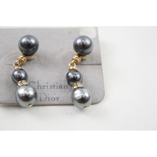 216 - Pair of gold tone simulated pearl drop earrings by designer Christian Dior