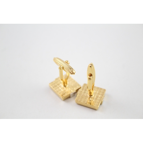 225 - Pair of gold tone cufflinks by designer Givenchy