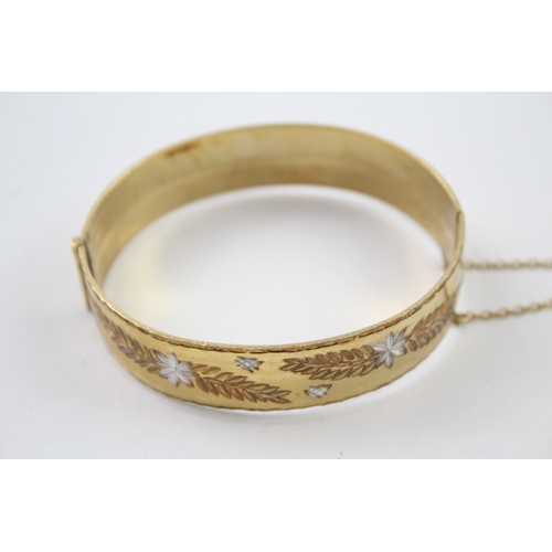 226 - Rolled gold bangle with floral design