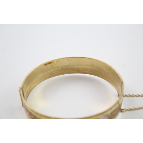 226 - Rolled gold bangle with floral design