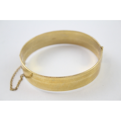 226 - Rolled gold bangle with floral design