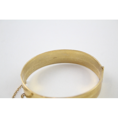 226 - Rolled gold bangle with floral design