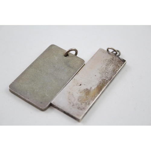 228 - Two silver ingot pendants 1978 with etched designs