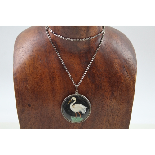 234 - Silver antique double sided bird pendant with chain