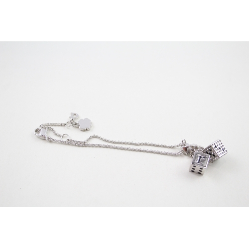 235 - Silver tone dice charm bracelet by designer Christian Dior