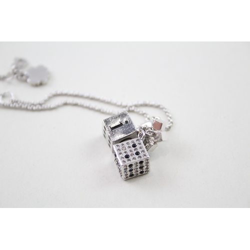 235 - Silver tone dice charm bracelet by designer Christian Dior