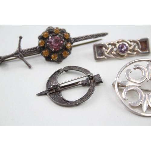 238 - Five silver Scottish/Celtic brooches including gemstone