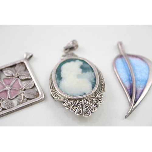 243 - Three silver pendants including enamel