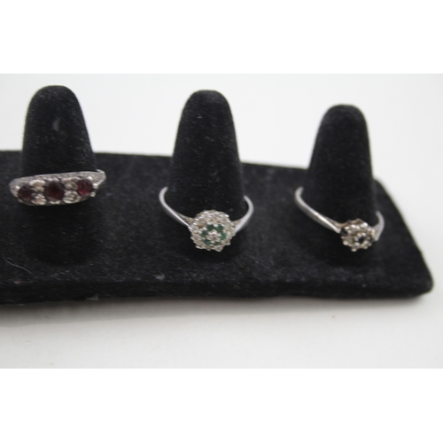 249 - A collection of silver vintage gemstone rings including Emerald