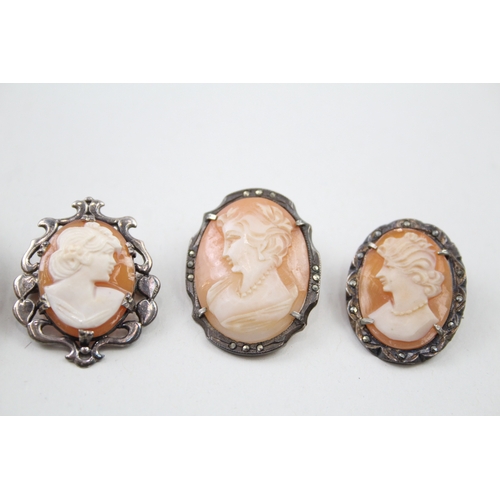 255 - Four silver shell cameo brooches including marcasite