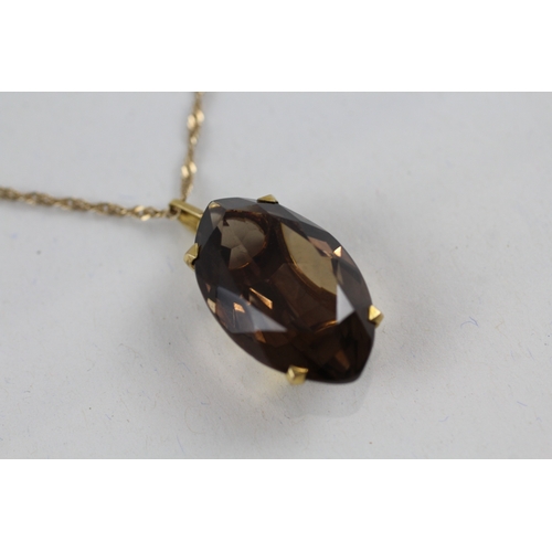 44 - 9ct gold smokey quartz pendant necklace (7.3g)