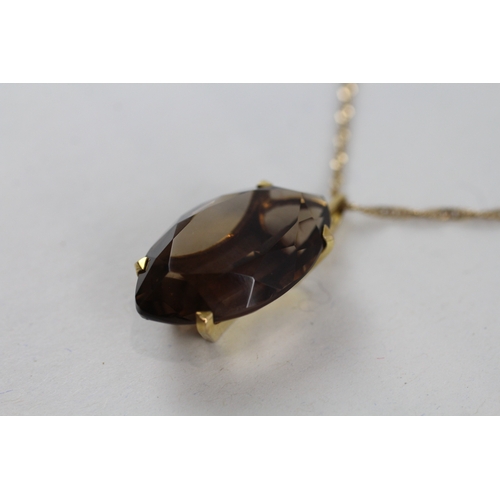 44 - 9ct gold smokey quartz pendant necklace (7.3g)