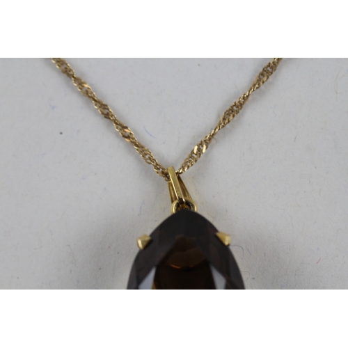 44 - 9ct gold smokey quartz pendant necklace (7.3g)