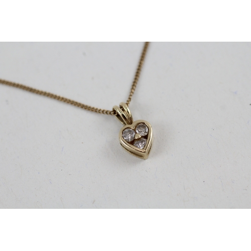 47 - 9ct gold diamond heart pendant with 9ct gold chain (1.7g)