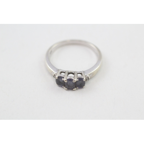 6 - 9ct gold tanzanite three stone ring with diamond sides (2.3g) Size  N