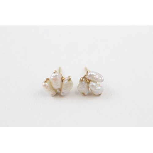 70 - 14ct gold rice pearl stud earrings (1.3g)