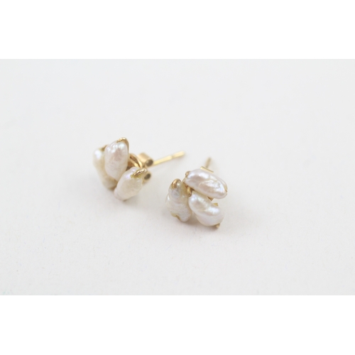 70 - 14ct gold rice pearl stud earrings (1.3g)