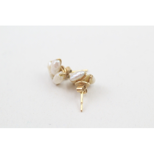 70 - 14ct gold rice pearl stud earrings (1.3g)