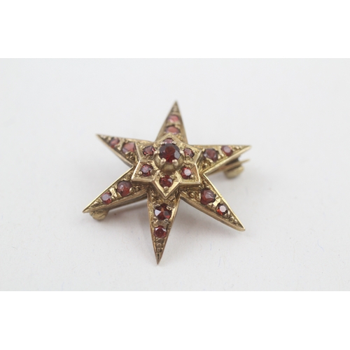 74 - 9ct gold vintage garnet star brooch (3.4g)