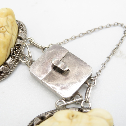 285 - Carved bone and silver bracelet and matching ring (60.5g)