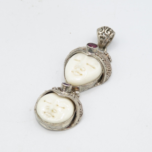 291 - 2 x Carved bone and silver pendants (27.3g)