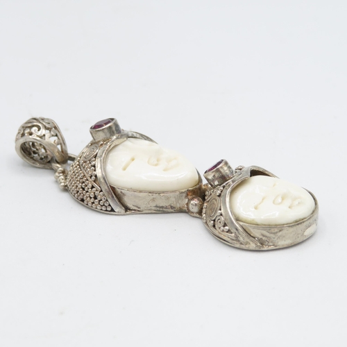 291 - 2 x Carved bone and silver pendants (27.3g)