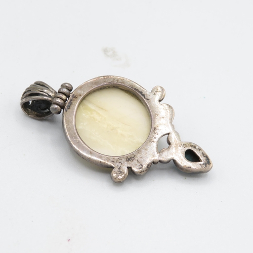 291 - 2 x Carved bone and silver pendants (27.3g)