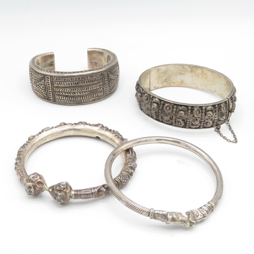 296 - Collection of foreign silver bangles (109g)